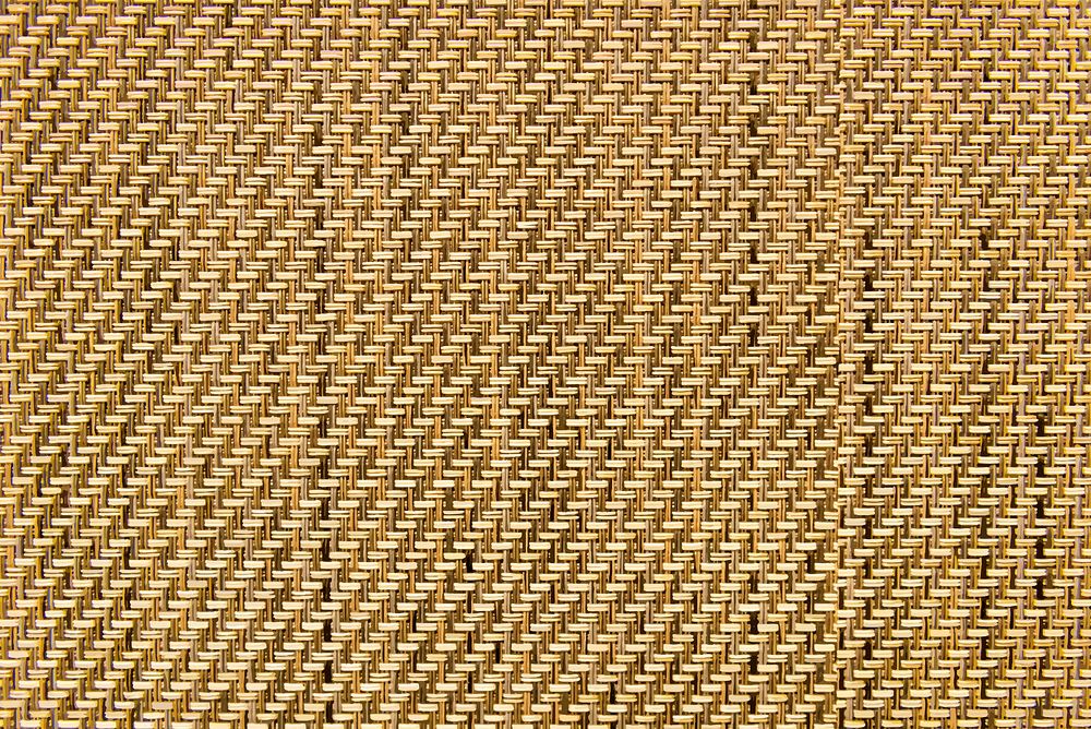 Brown weaved mat textured background vector