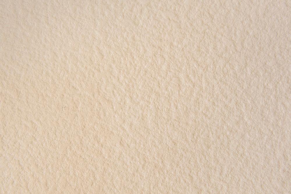 Blank beige textured wallpaper background