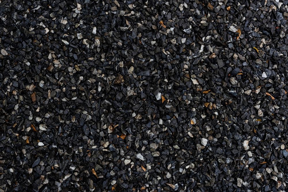 Wet dark granite gravel textured background