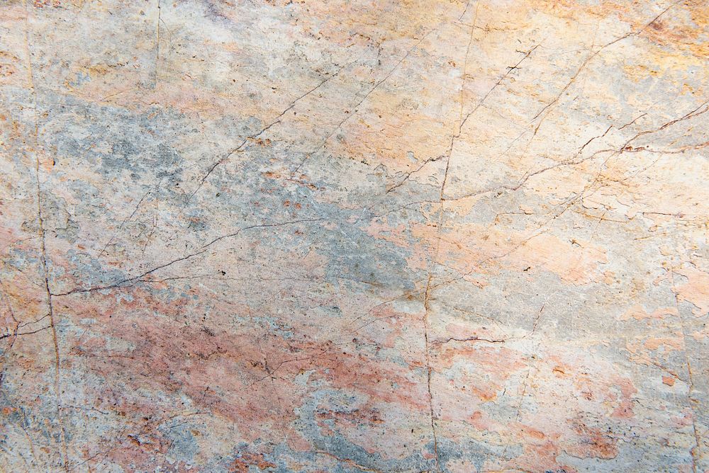 Cracked pastel color cement textured background