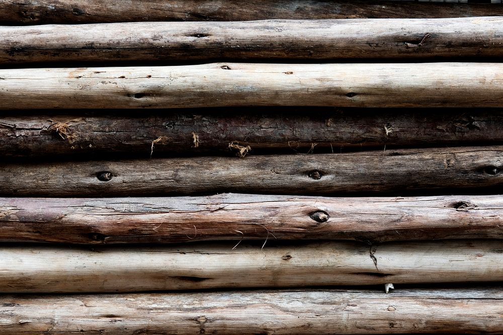Beige wood logs textured background
