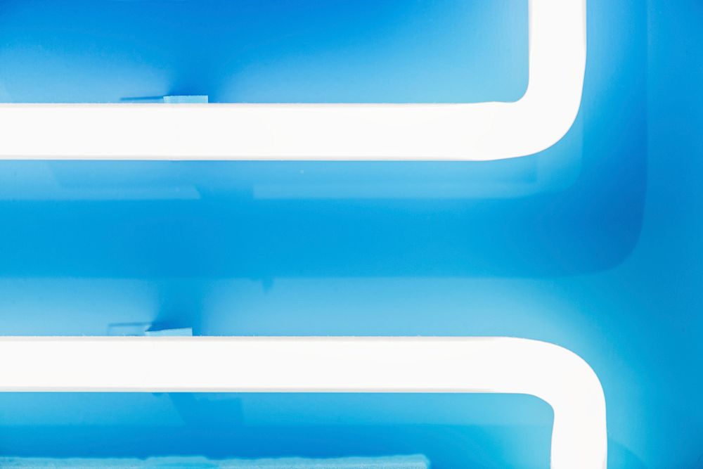 Glowing blue neon tube textured background