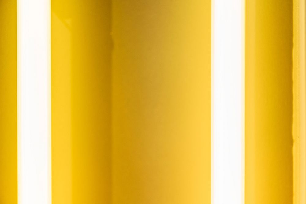 Glowing yellow neon tube textured background