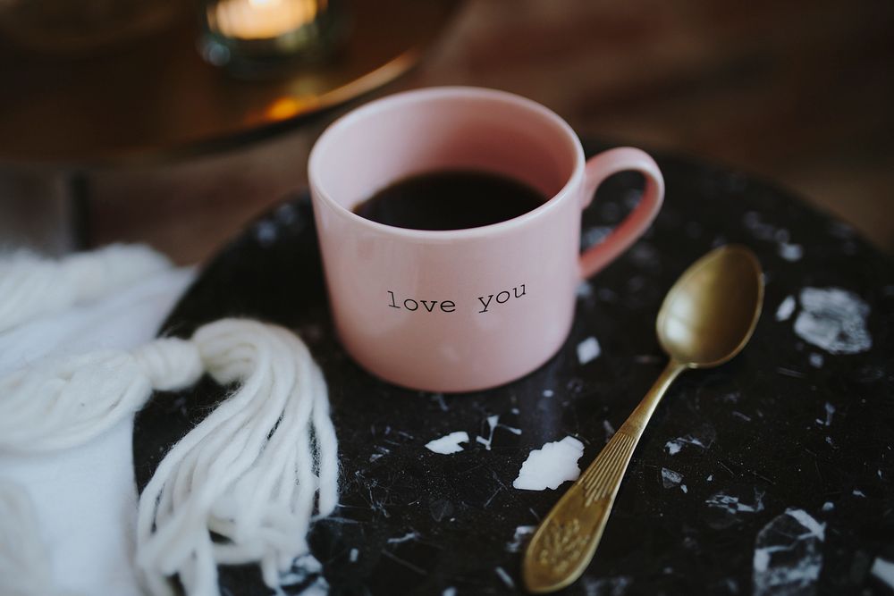 Hot black coffee in a pink cup