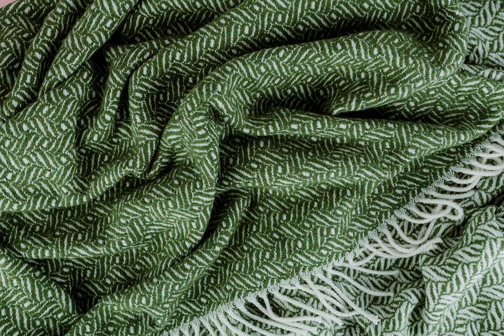 Green woven textured scarf background