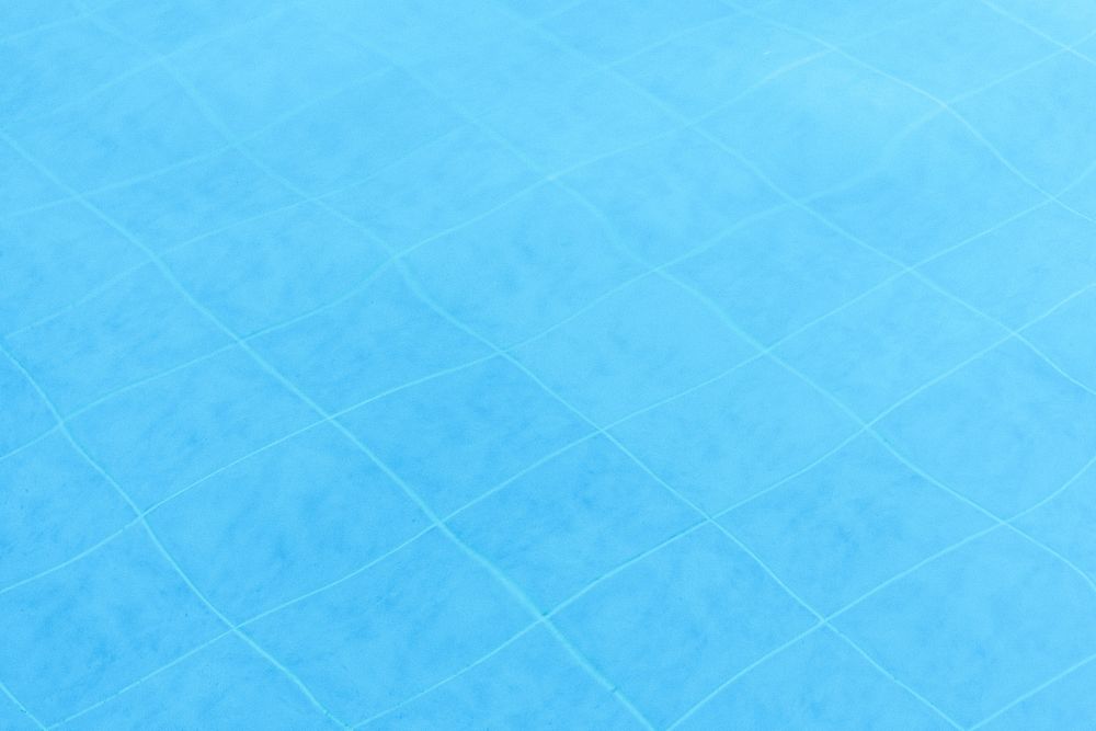 Blue swimming pool textured background