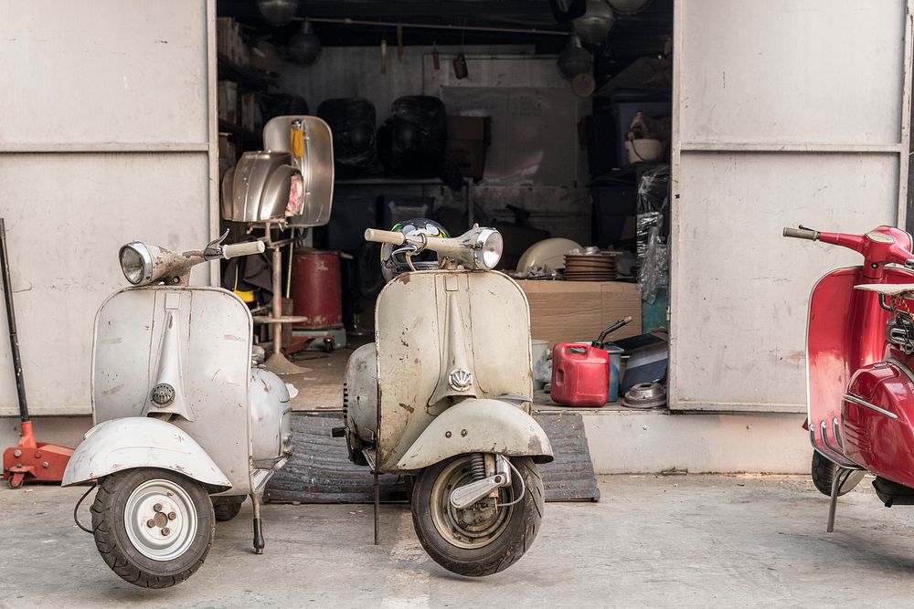 Old scooter parked on a street