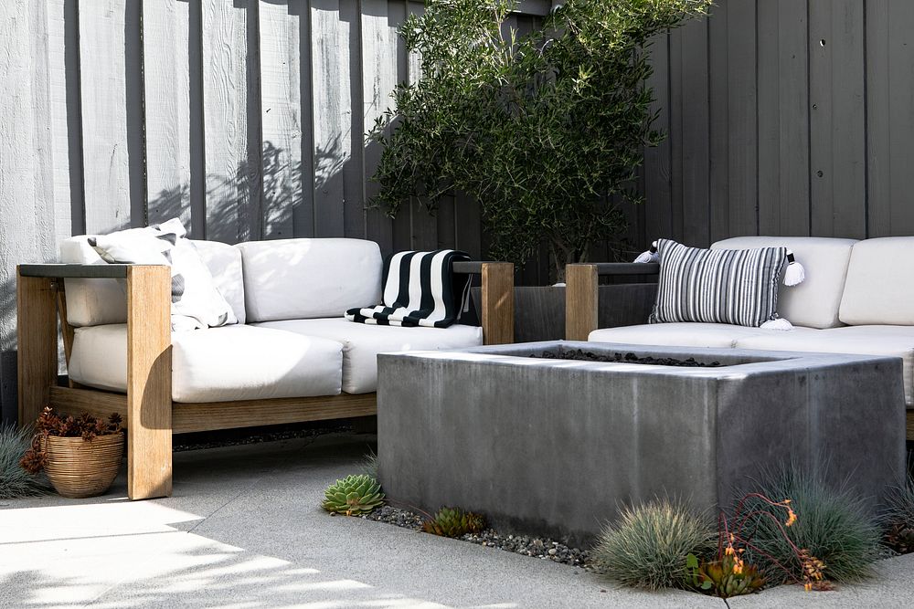 Outdoor wooden couch with a fireplace