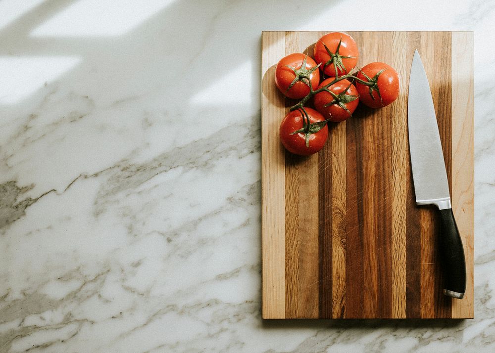 Fresh tomatoes on a cutting board