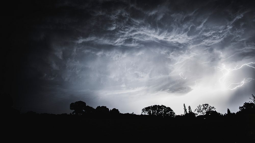 Nature desktop wallpaper background, stormy night sky in the countryside