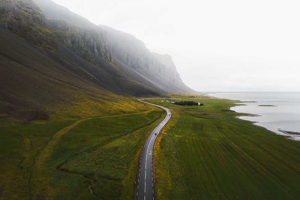 SUV car driving in the countryside drone shot