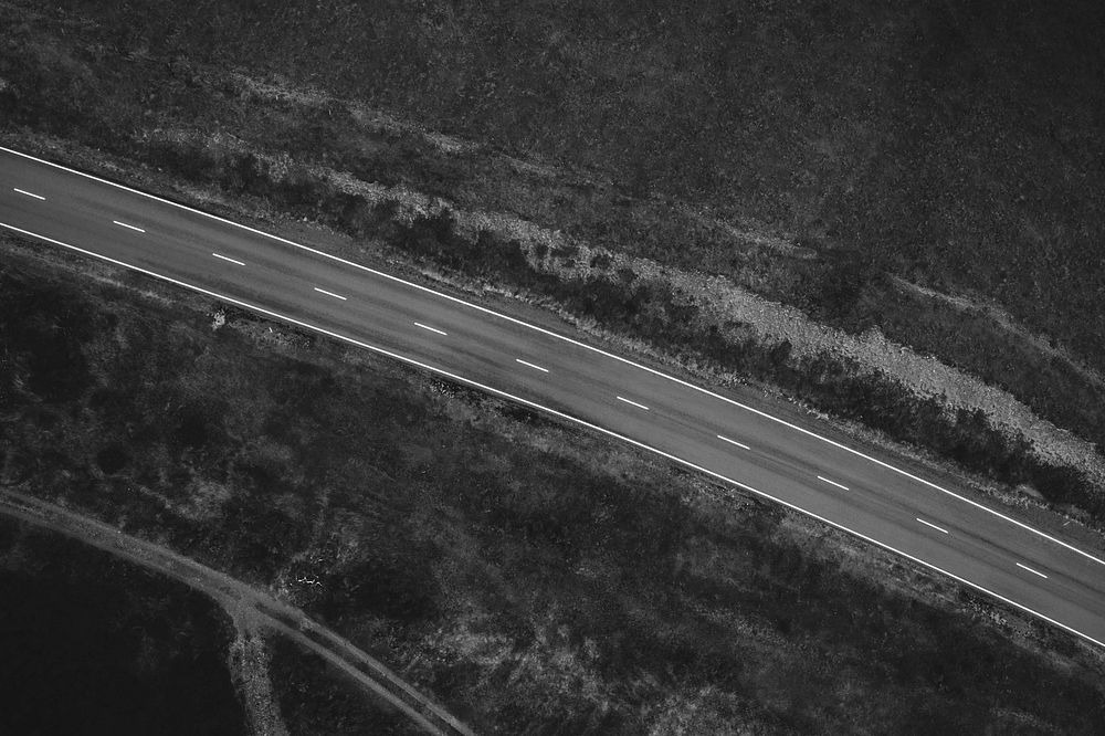 Road to somewhere among a grassland drone view