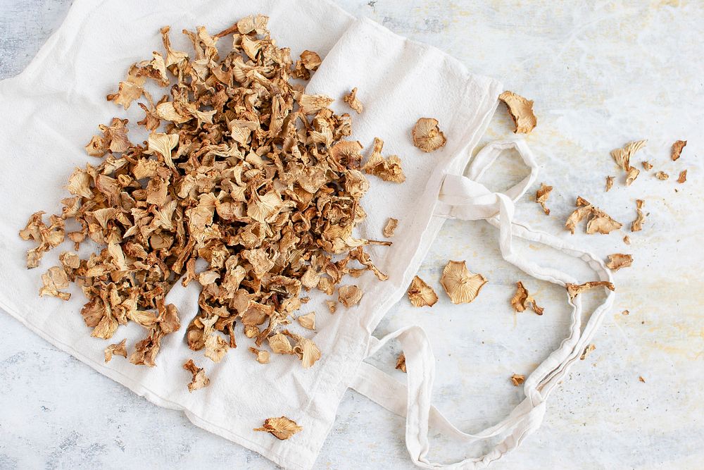 Dried mushrooms on a white tote bag