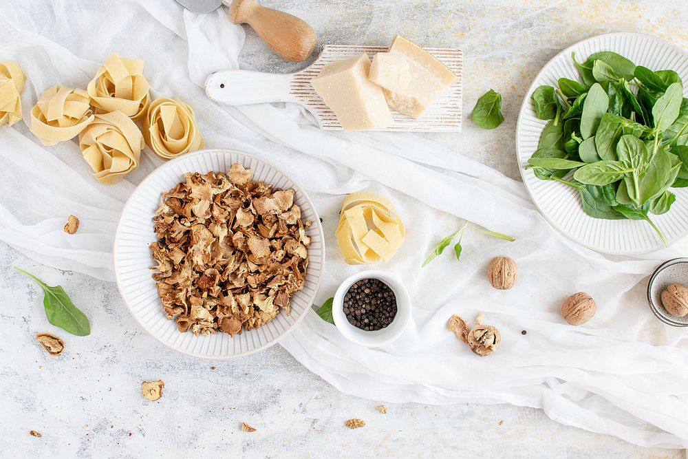 Ingredients for a homemade pappardelle pasta with mushrooms