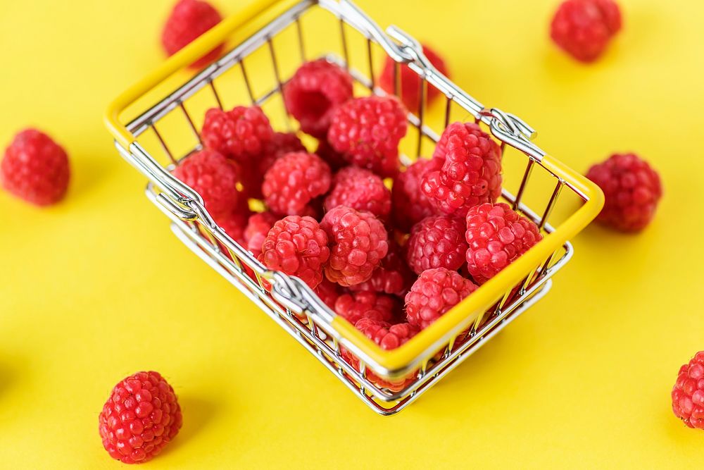 Fresh raspberries in a mini basket