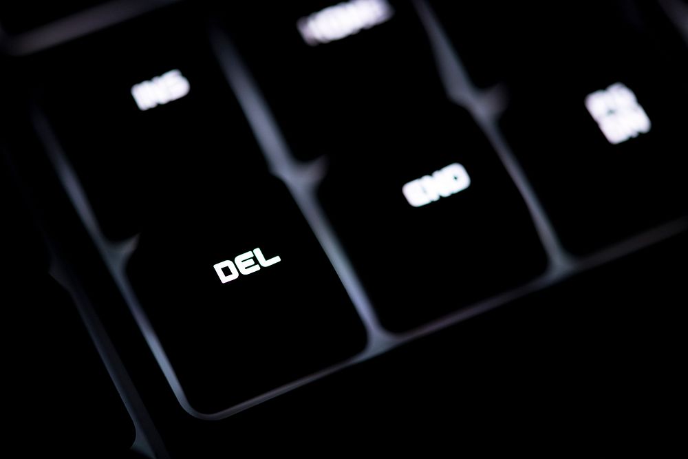 Closeup of a black computer keyboard and DEL button