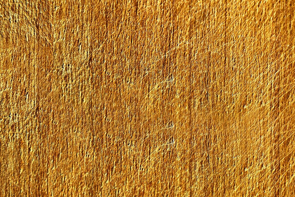 Close up of a yellow scratched concrete wall texture