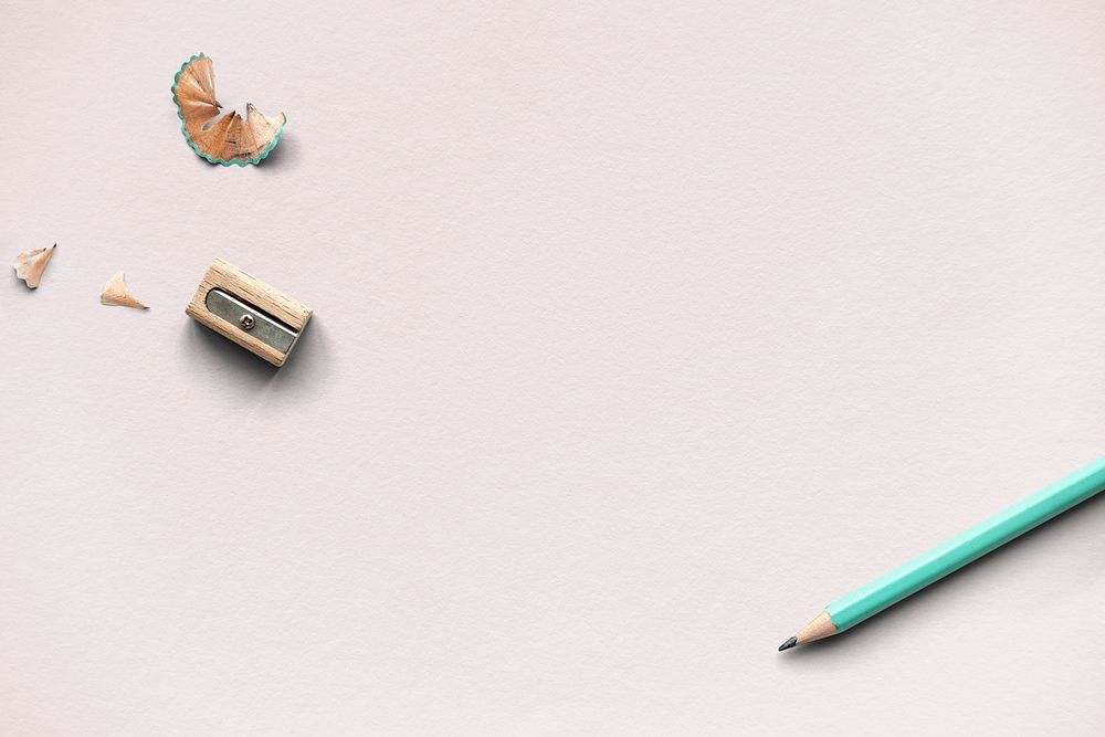 Pencil and sharpener on a pink background
