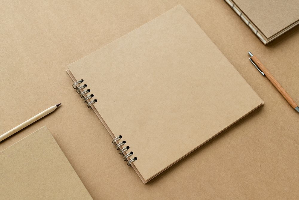Natural brown paper notebook with pencils