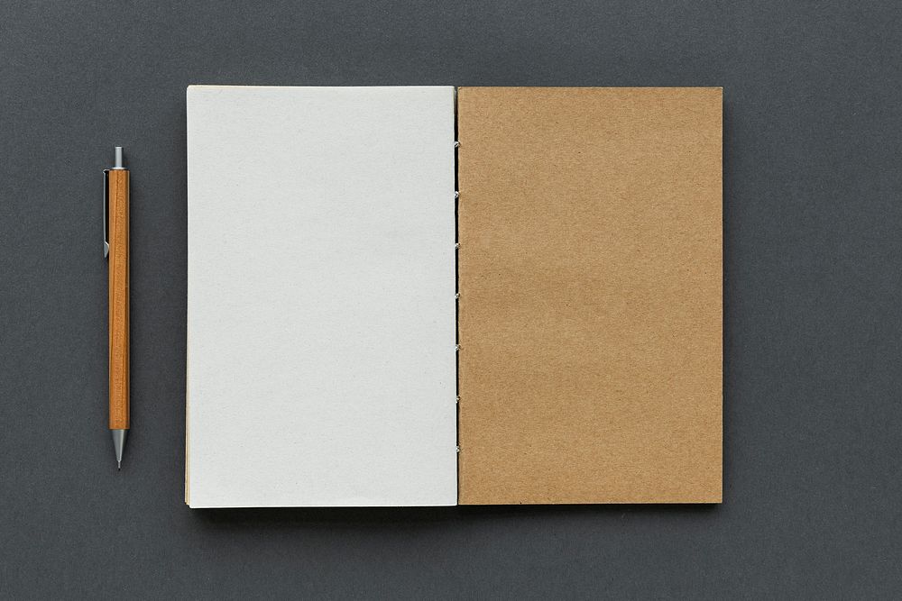 Blank plain notebook with a pencil