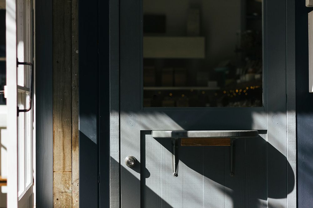 Sunlight on a gray wooden door