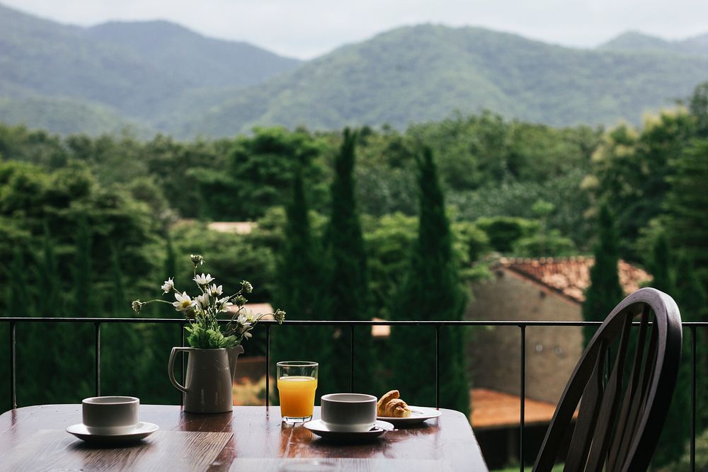 Breakfast on a wooden table with a natural view