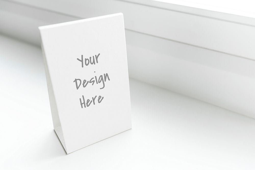White standing sign mockup in a window