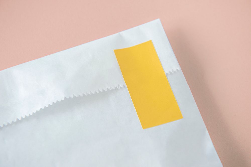 White package mockup with a yellow seal