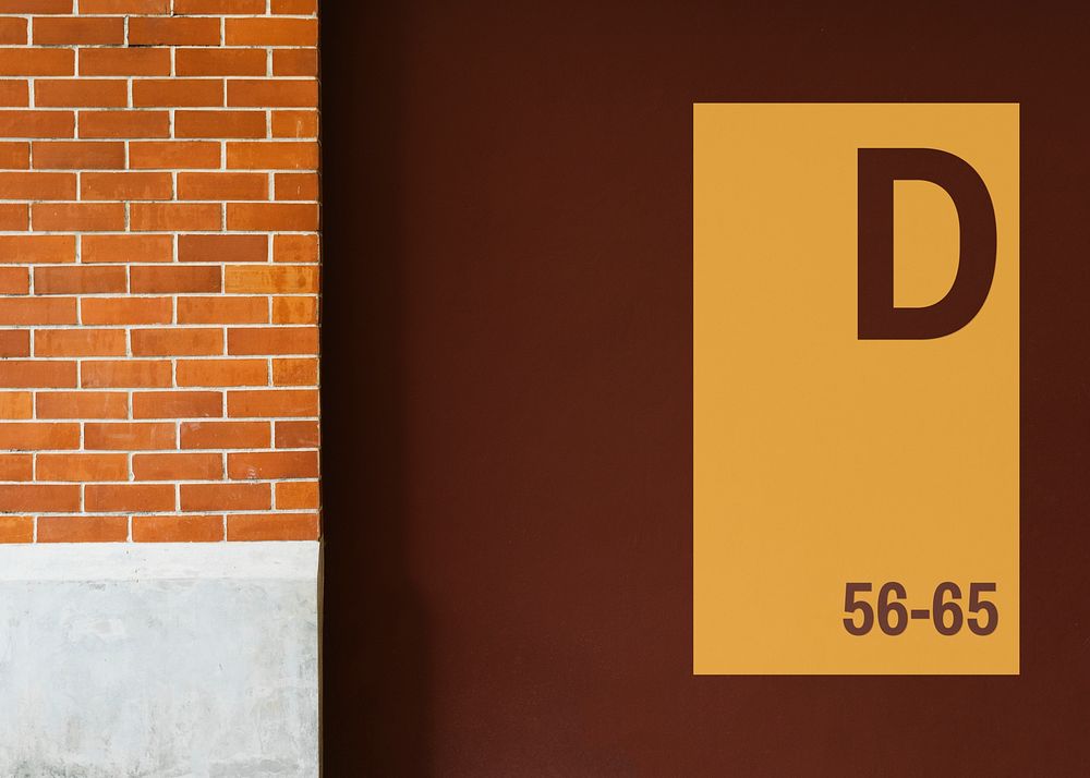 Yellow signboard mockup on a brown wall