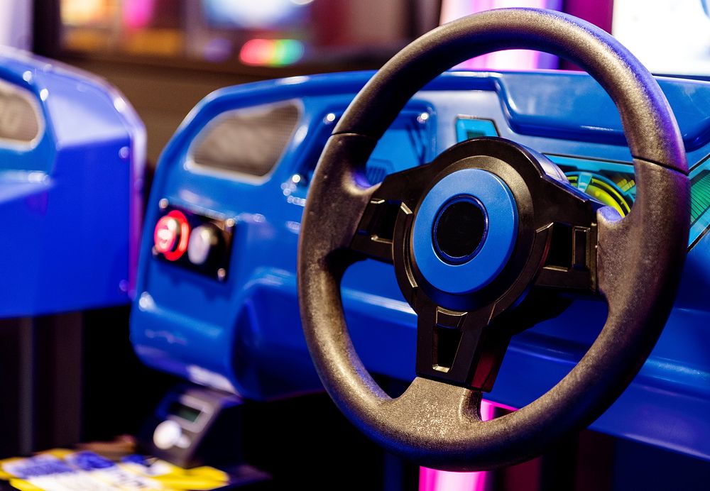 Steering wheel of a car ride in an arcade