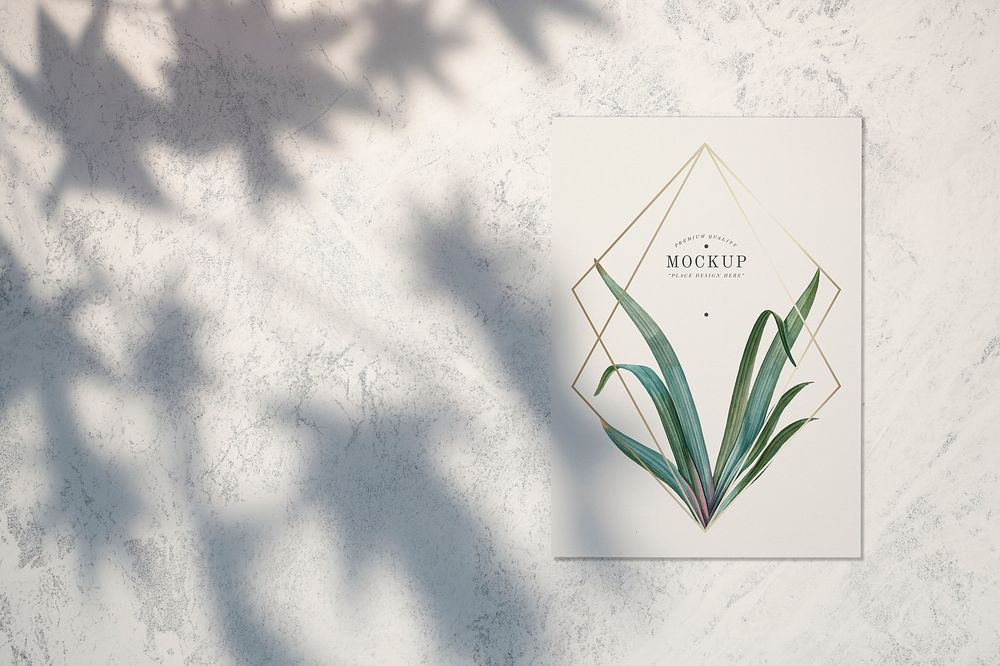 Premium quality card mockup with leaves and golden frames psd