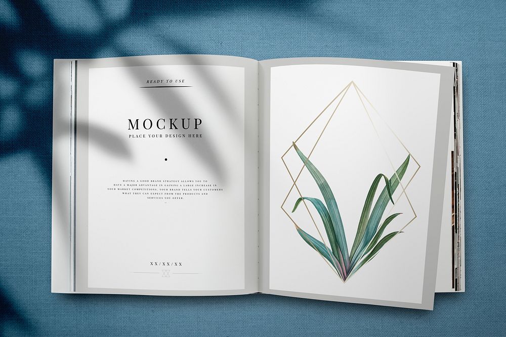 Magazine mockup with leaves and golden frame psd