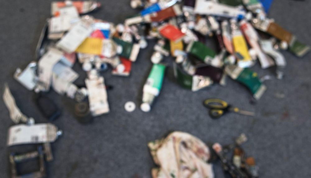 Empty acryllic paint tubes in an art studio