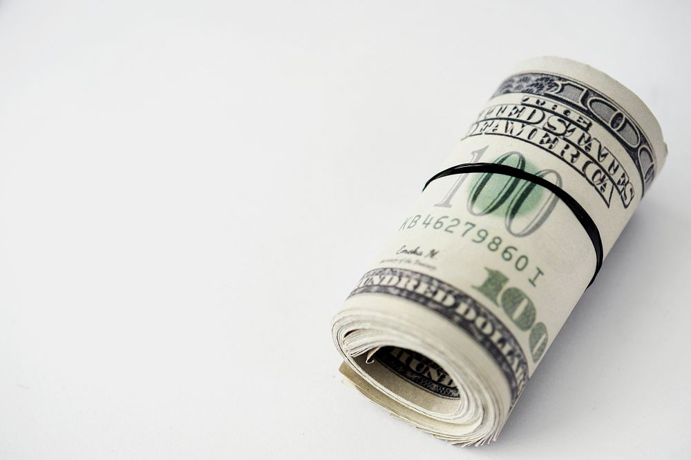 Closeup of money bundle isolated on white background