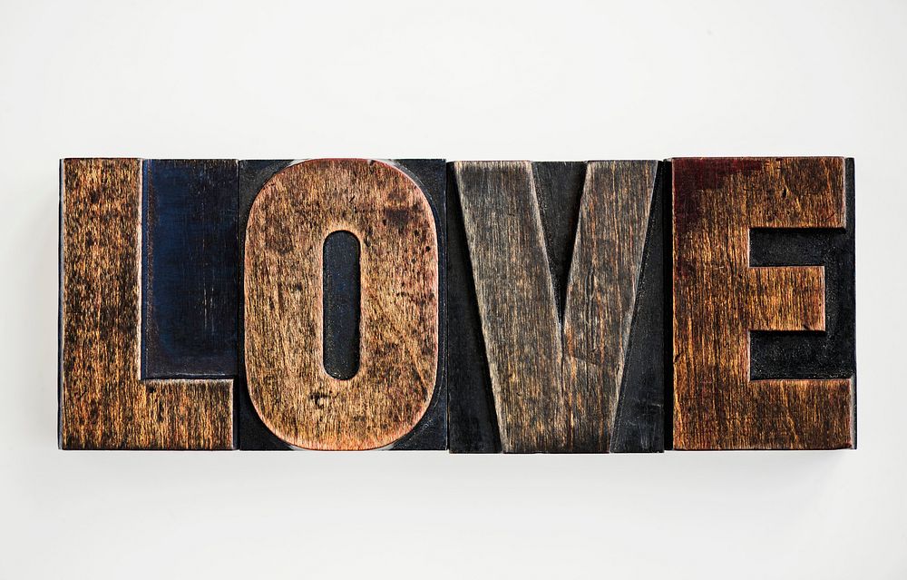 Closeup of the word "Love" isolated on white background