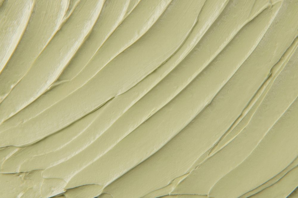 Green Cake frosting texture background close-up