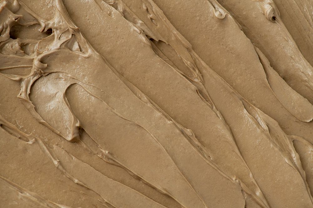Brown frosting texture background close-up