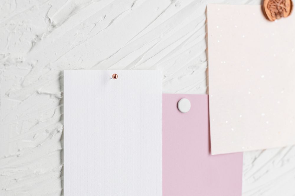 Pinned paper tag, blank notes on textured white background
