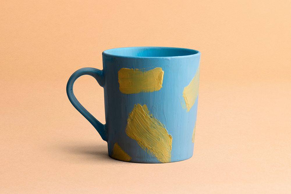 Acrylic painted blue mug in aesthetic creative style