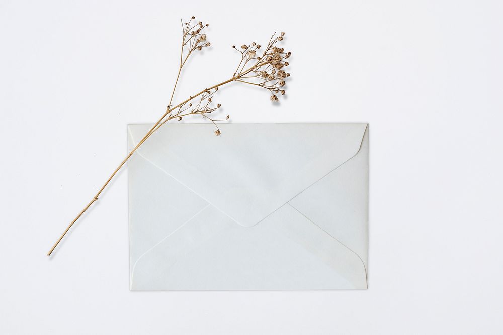 White letter envelope mockup psd stationery on the table