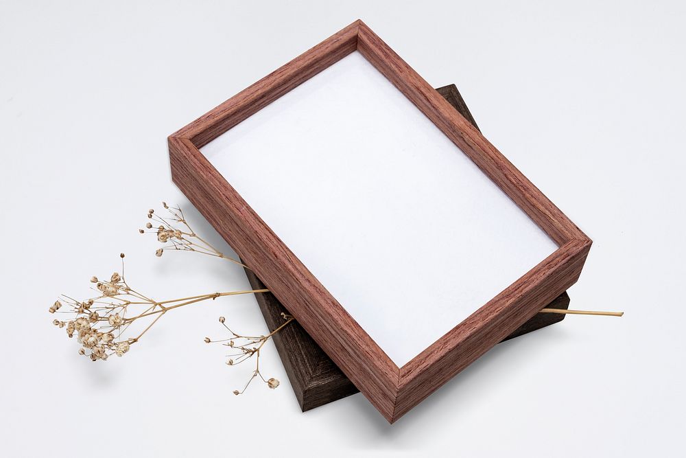 Wooden picture frame mockup psd with aesthetic dried flower
