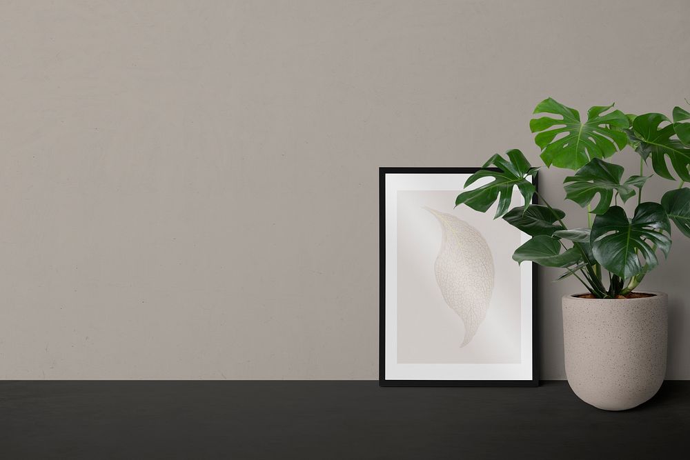 Picture frame psd mockup leaning against a wall