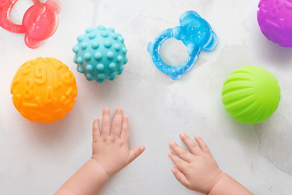 Baby hands background playing developing toys image