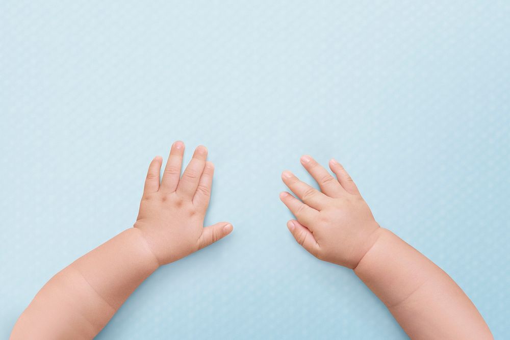 Cute baby hands psd background in blue