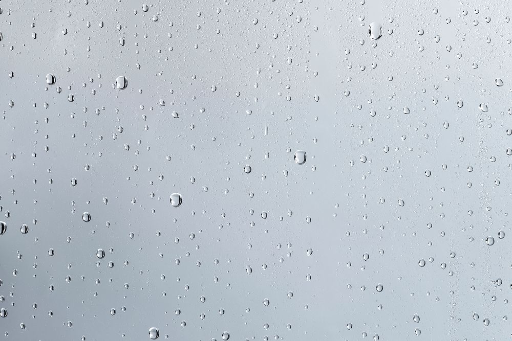 Water texture background, rainy window on cloudy day