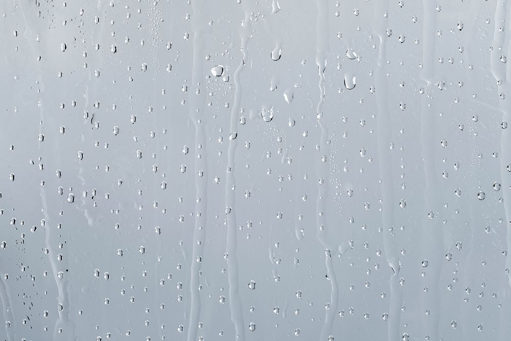 Water texture background, rainy window on cloudy day