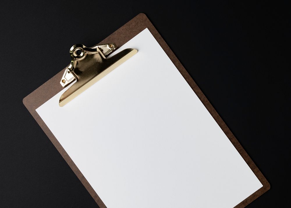 Blank white paper on brown clipboard, flat lay