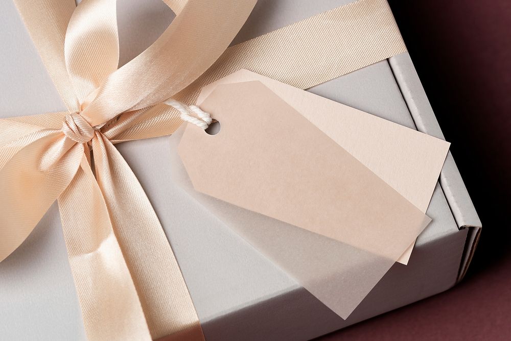White gift box with blank greeting tag, occasionally present