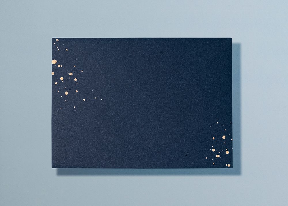 Blank navy blue card, gold glitter, flat lay design