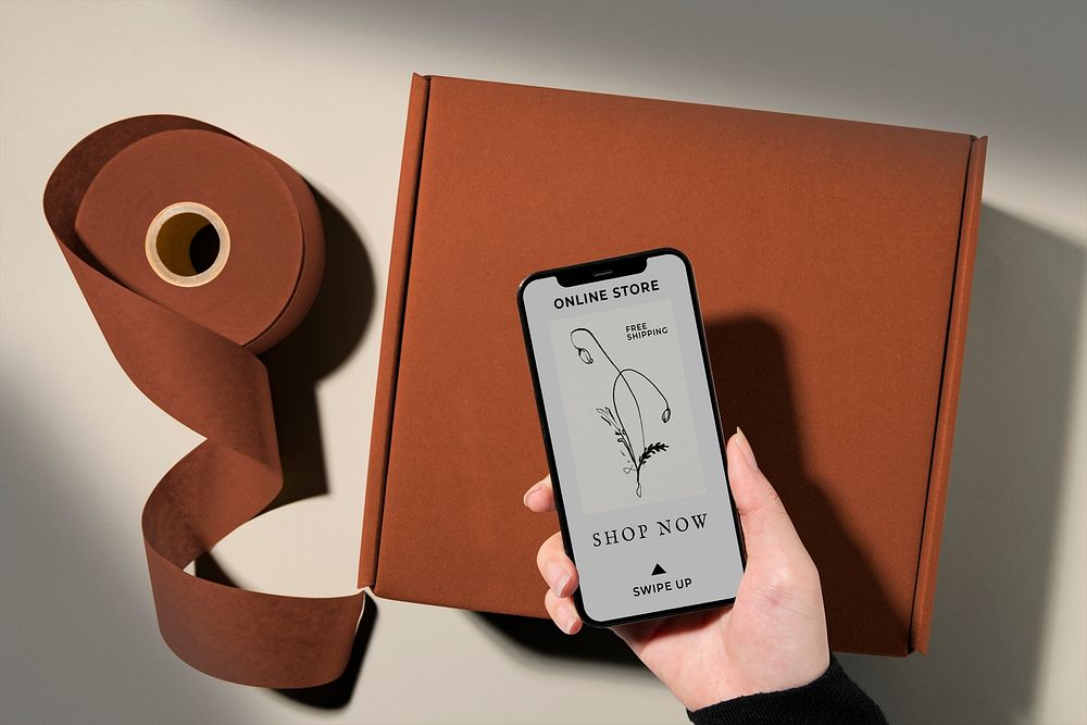 Phone screen mockup, online business concept, brown parcel box below